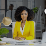 Confident entrepreneur at a modern desk reviewing documents, representing how to explain what you do in business through clear messaging, structured strategy, and professional systems that help founders communicate their value with confidence and consistency.